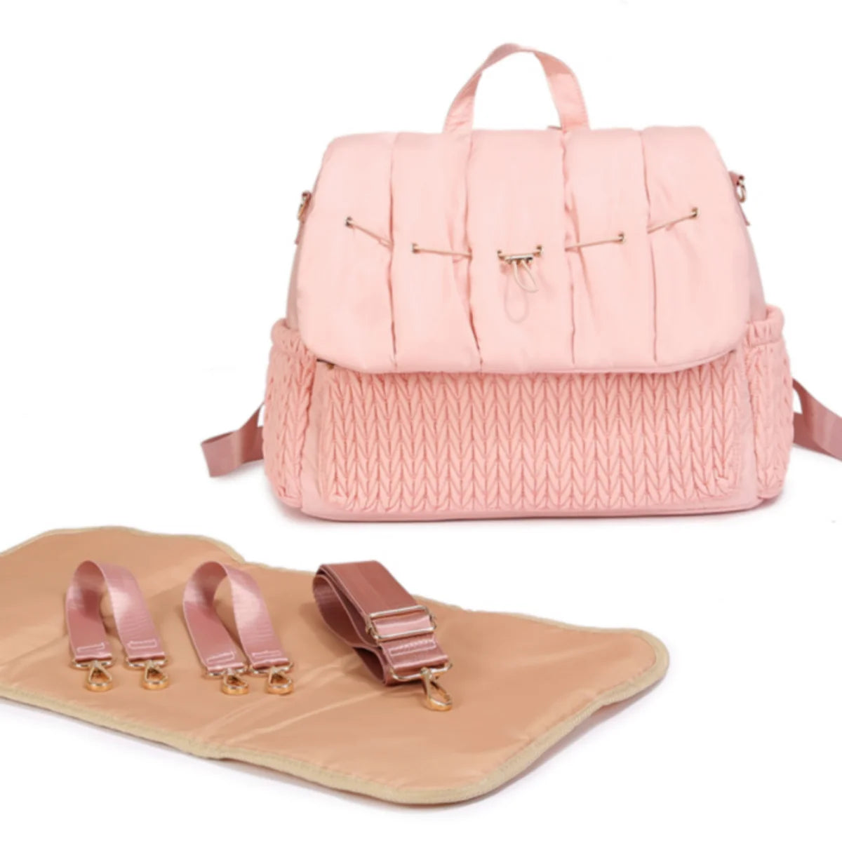 sac a langer de couleur beige avec tapis a langer