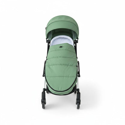 Chancelière poussette vert installé dans une poussette noir